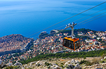 a cable car above a city