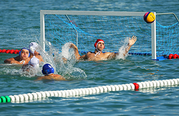 a group of women playing water polo