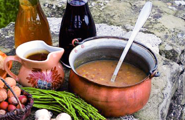 a bowl of soup with a spoon