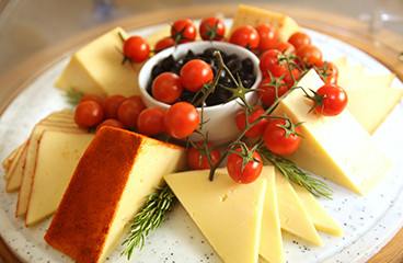 a plate of cheese and tomatoes