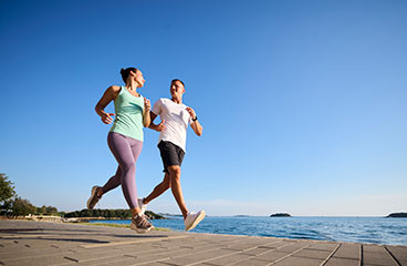 a group of men playing volleyball on a beach