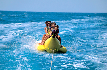 a group of people on a raft in the water