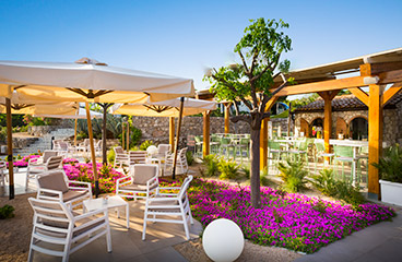 a couple sitting on a patio