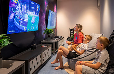 a group of children playing on a video game console