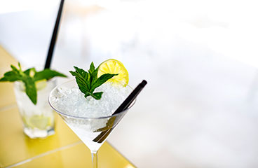 a group of glasses with liquid in them